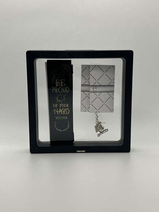 GRADUATION - “Be proud of your hard work” - Black Satin Reusable Adhesive Bookmark with a Charm (Grad Cap and Diploma) in Gift Box