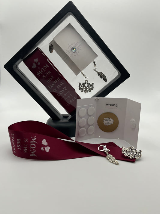 FOR MOM - “Mom is the best example of real love - forever grateful” – Burgundy Satin Reusable Adhesive Bookmark with Two Charms (M-O-M, Feather) in Gift Box + Hidden Scratch Gift Message