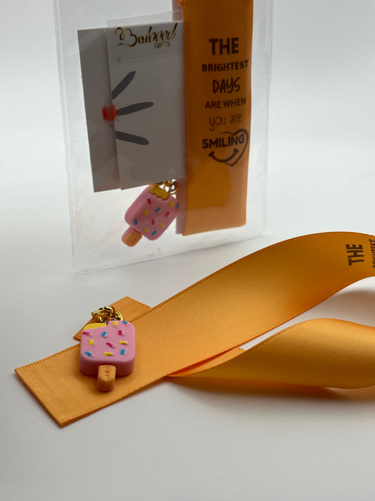LIFE SMILES – “The brightest days are when you are smiling” - Orange Satin Reusable Adhesive Bookmark with a Charm (Ice Cream Popsicle)