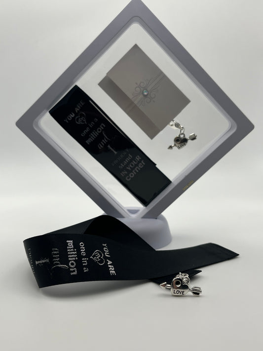 ANNIVERSARY - “You are one in a million and I proudly stand in your corner “- Black Satin Reusable Adhesive Bookmark with a Charm (Heart with Arrow) in Gift Box
