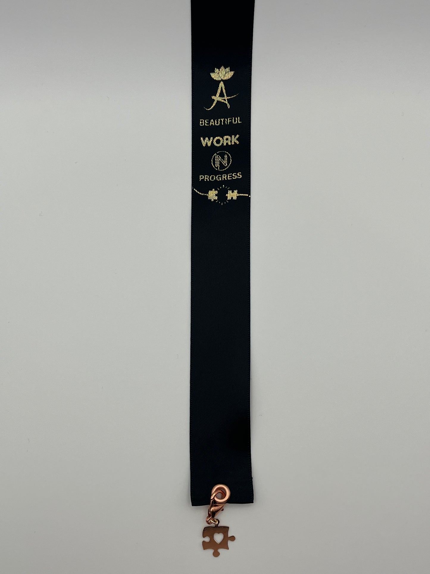 MOTIVATIONAL – “A beautiful work in progress” - Olive Green or Black Satin Reusable Adhesive Book-It™ Bookmark with a Charm (Puzzle Piece)