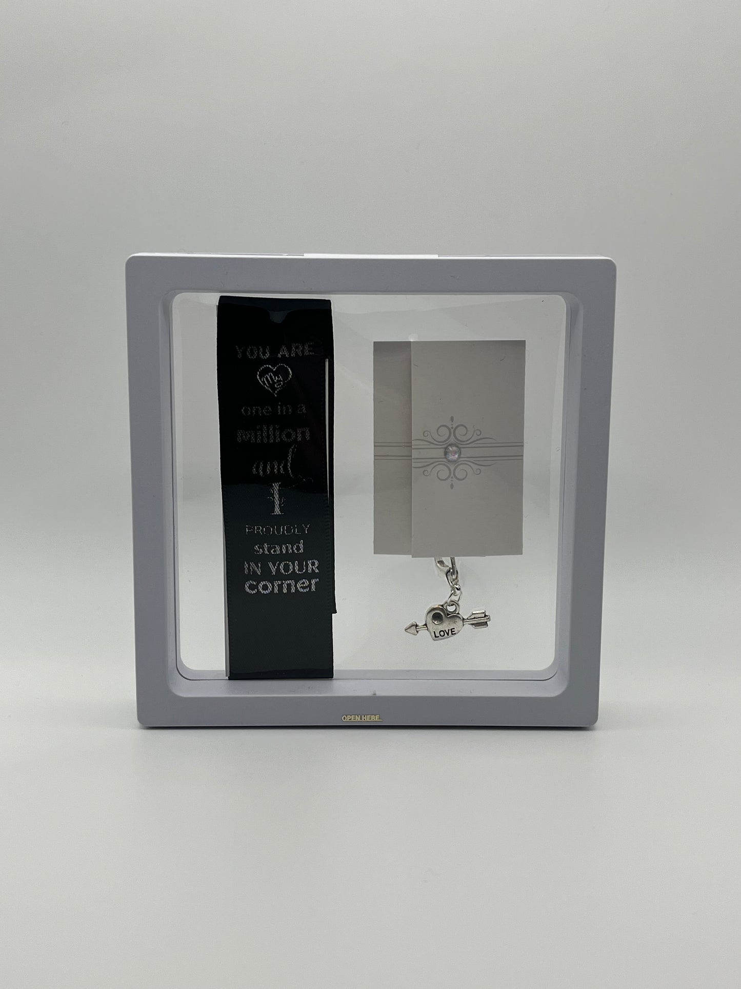 ANNIVERSARY - “You are one in a million and I proudly stand in your corner “- Black Satin Reusable Adhesive Bookmark with a Charm (Heart with Arrow) in Gift Box