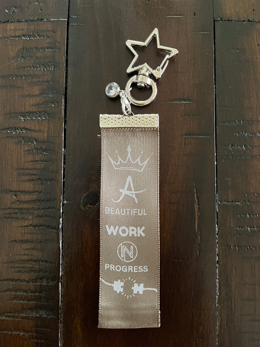 A Beautiful Work in Progress – Inspirational Keychain Gift - Olive Ribbon with White Text – Silver Swivel Star Keyring and Gem