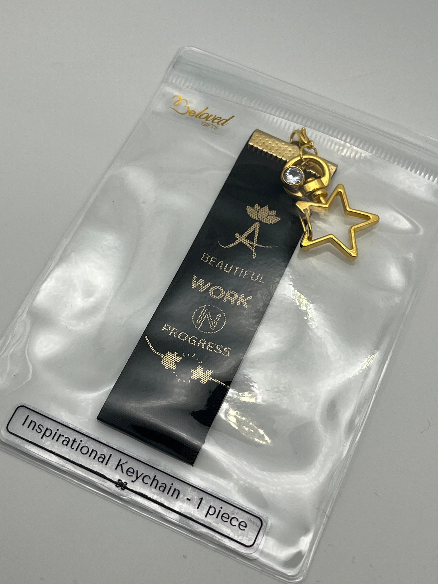 A Beautiful Work in Progress – Inspirational Keychain Gift - – Black Ribbon with Gold Text -  Gold Swivel Star Keyring and Gem