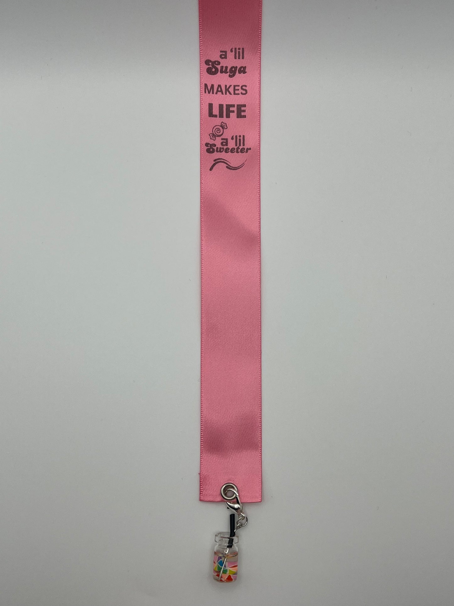 LIFE SWEETNESS – “A ‘lil suga makes life a ‘lil sweeter” - Pink Satin Reusable Adhesive Book-It™ Bookmark with a Charm (Candy Cup)