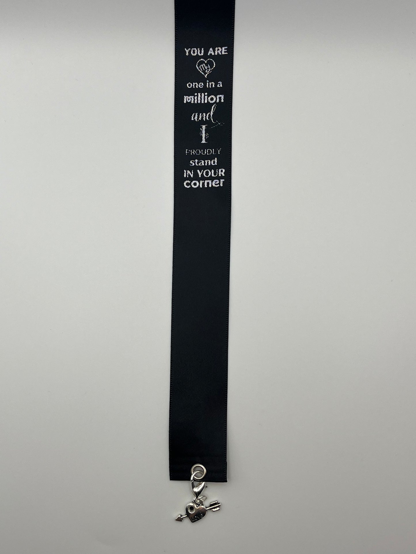 ANNIVERSARY - “You are one in a million and I proudly stand in your corner “- Black Satin Reusable Adhesive Book-It™ Bookmark with a Charm (Heart with Arrow) in Gift Box