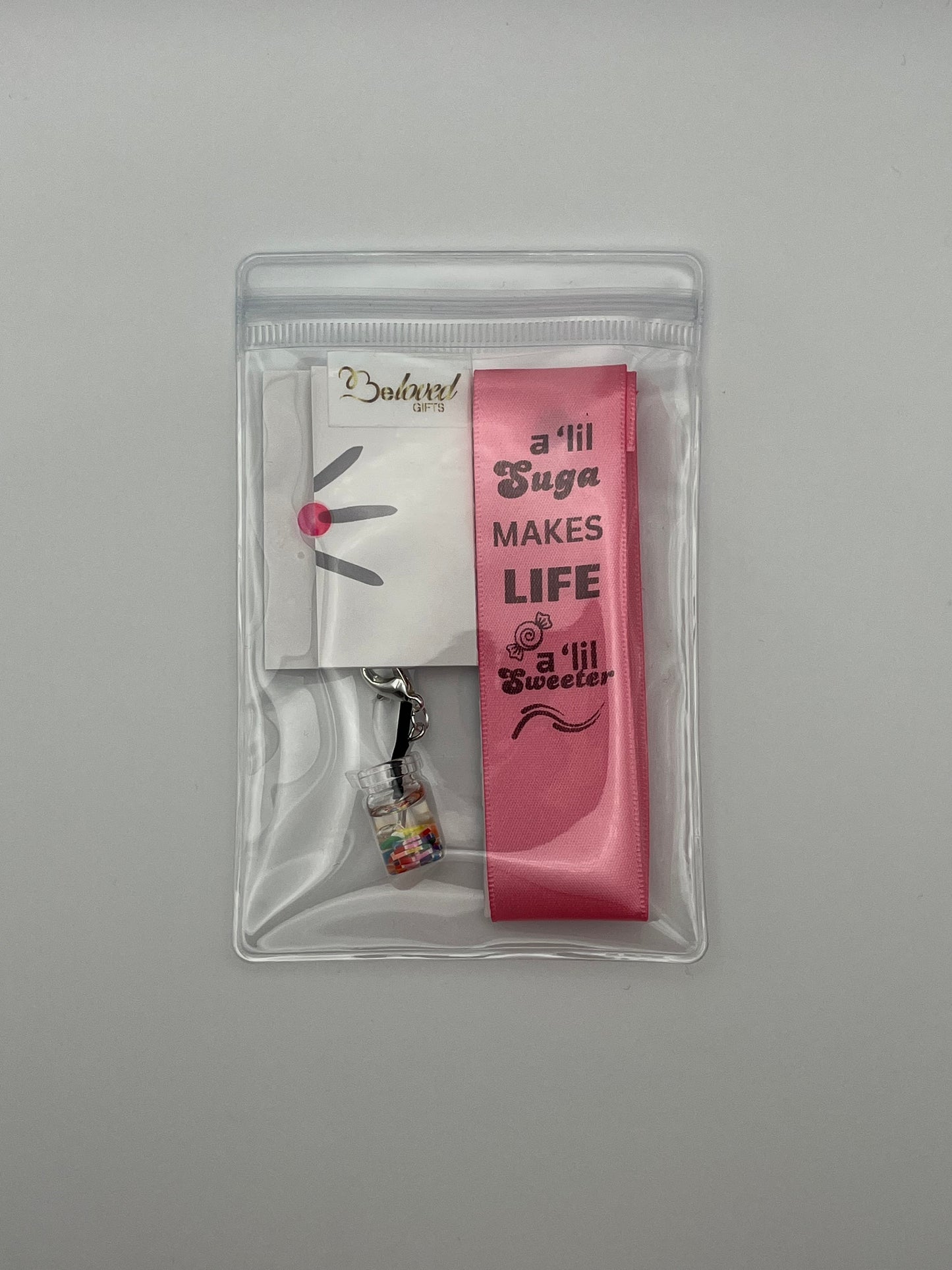 LIFE SWEETNESS – “A ‘lil suga makes life a ‘lil sweeter” - Pink Satin Reusable Adhesive Book-It™ Bookmark with a Charm (Candy Cup)