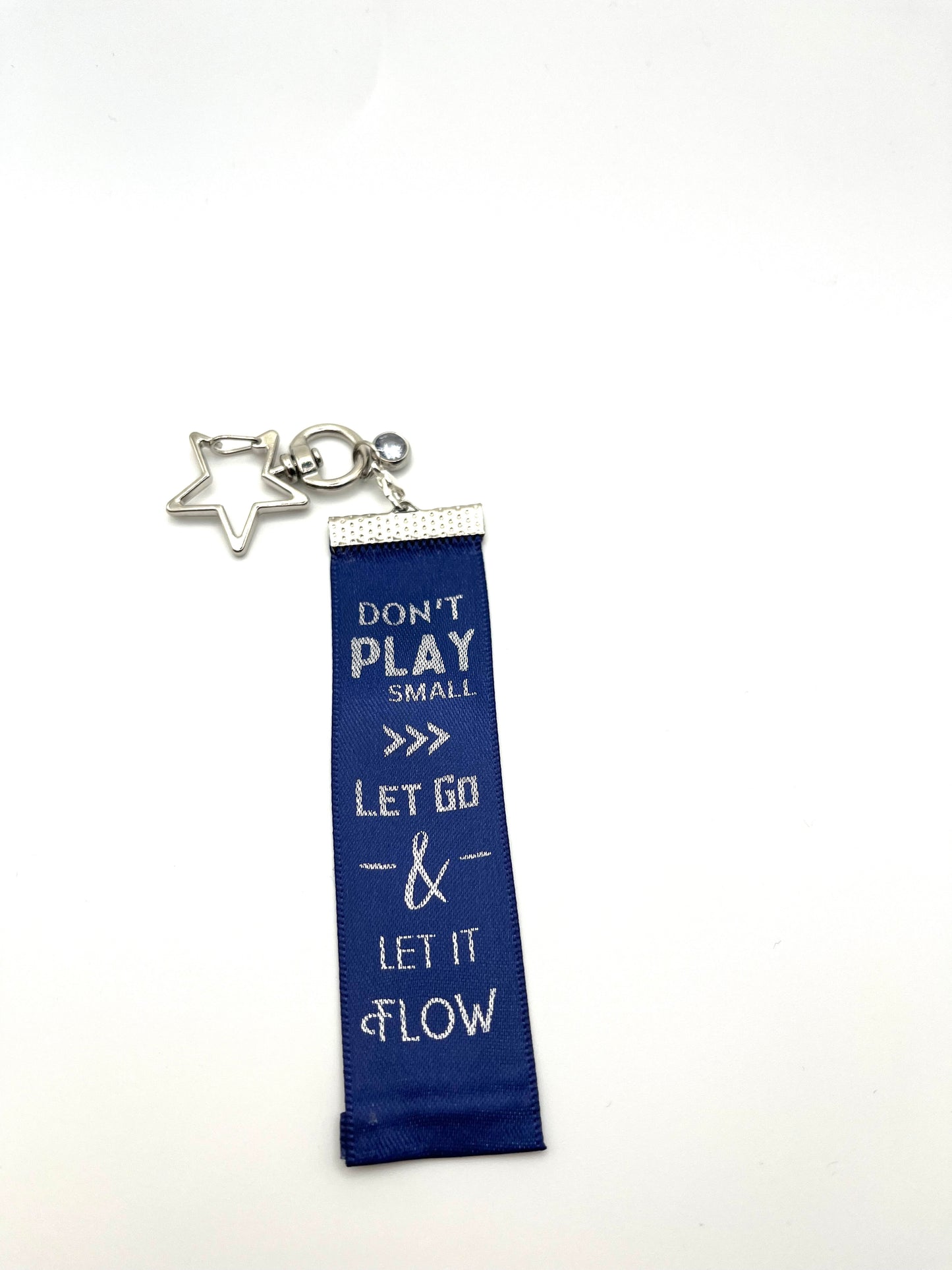 Don’t Play Small, Let Go & Let it Flow – – Inspirational Keychain Gift - Navy Ribbon with Silver Text - Silver Swivel Star Keyring and Gem